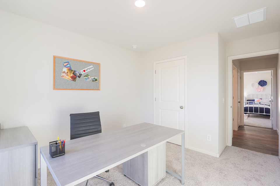 A room with a table and a door.