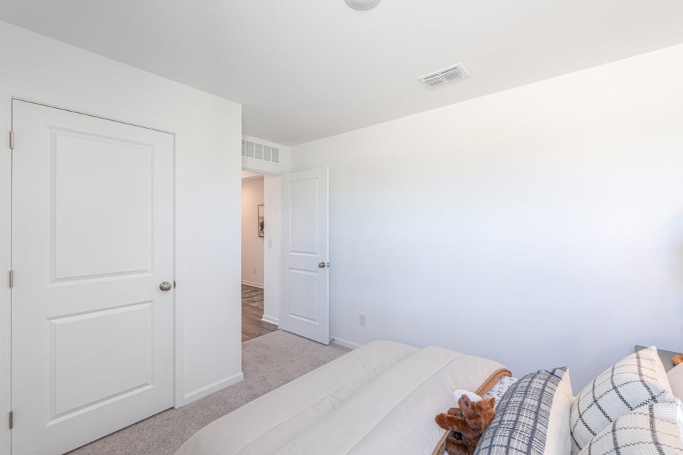 A room with white walls and a couch.