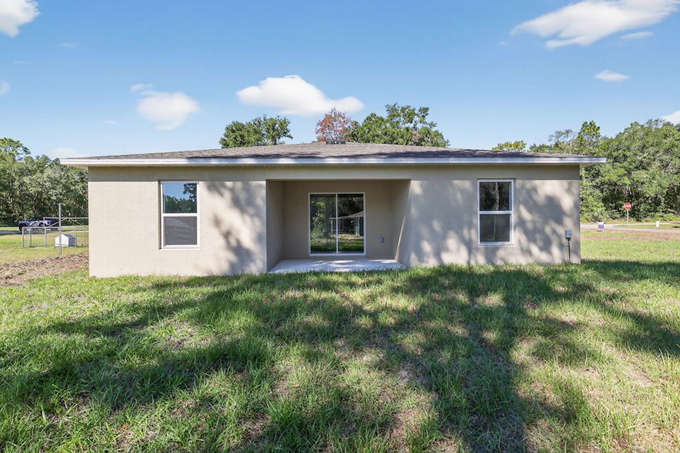 A house with a grass yard.