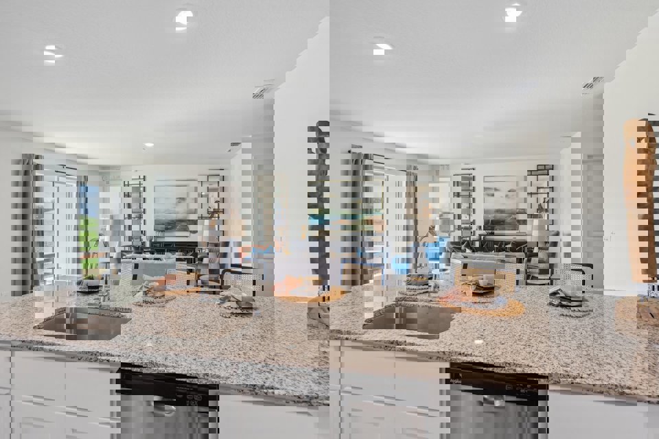 A kitchen with a marble counter top.