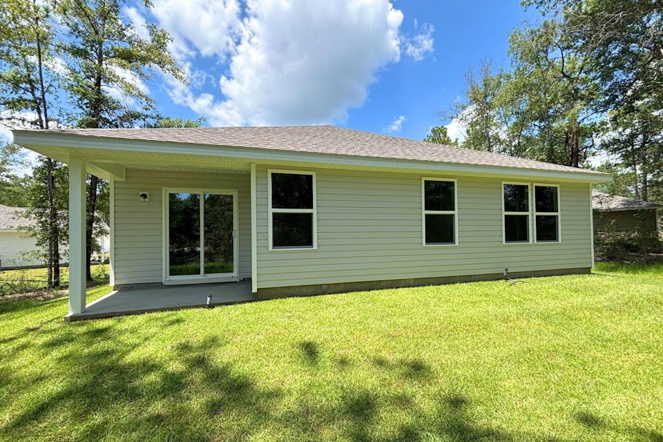 A house with a grass yard.