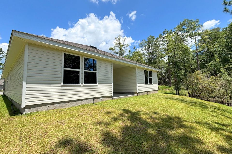 A house with a grass yard.