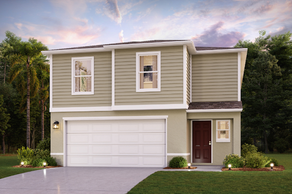 A white house with a garage.
