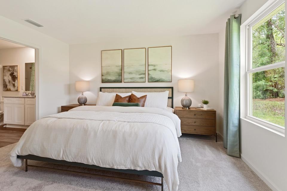 A bedroom with a large bed.