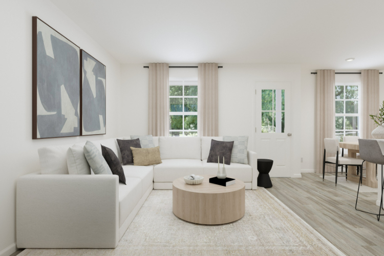 A living room with a white couch.