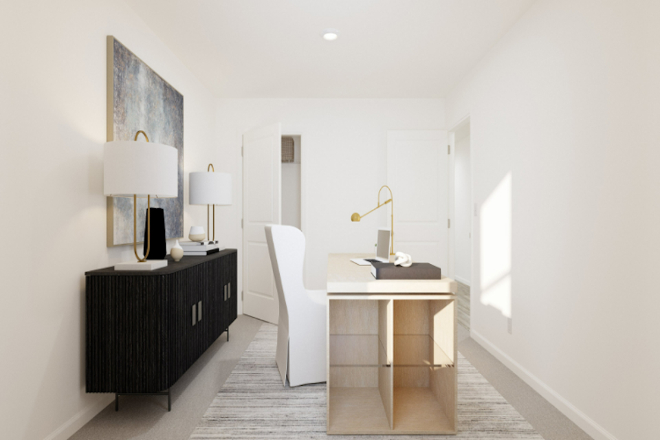 A room with a desk and a chair.