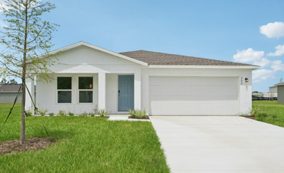 A white house with a garage.