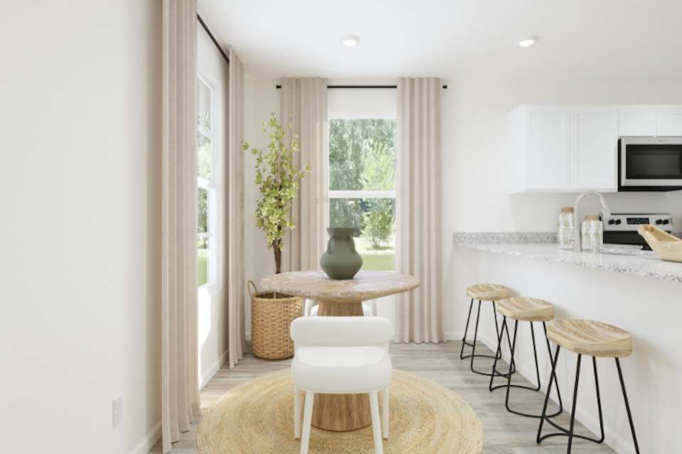 A room with a table and chairs.