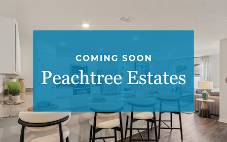 A room with chairs and a blue wall with white text.