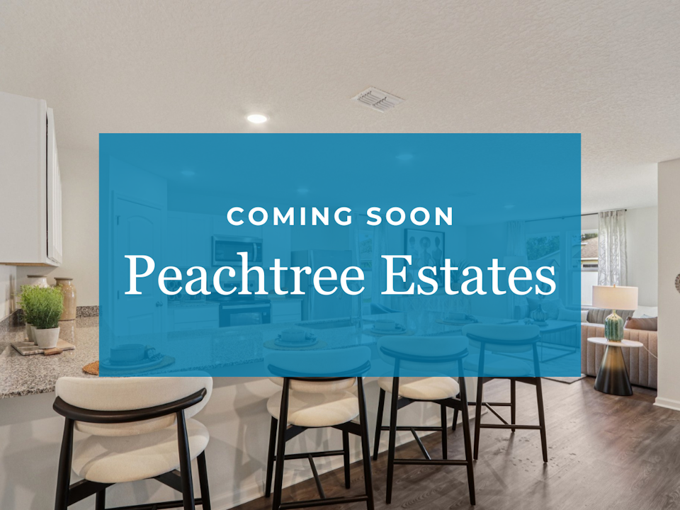 A room with chairs and a blue wall with white text.