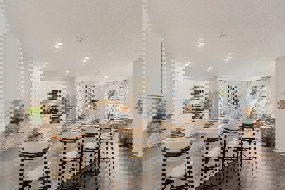 A kitchen with a marble counter.