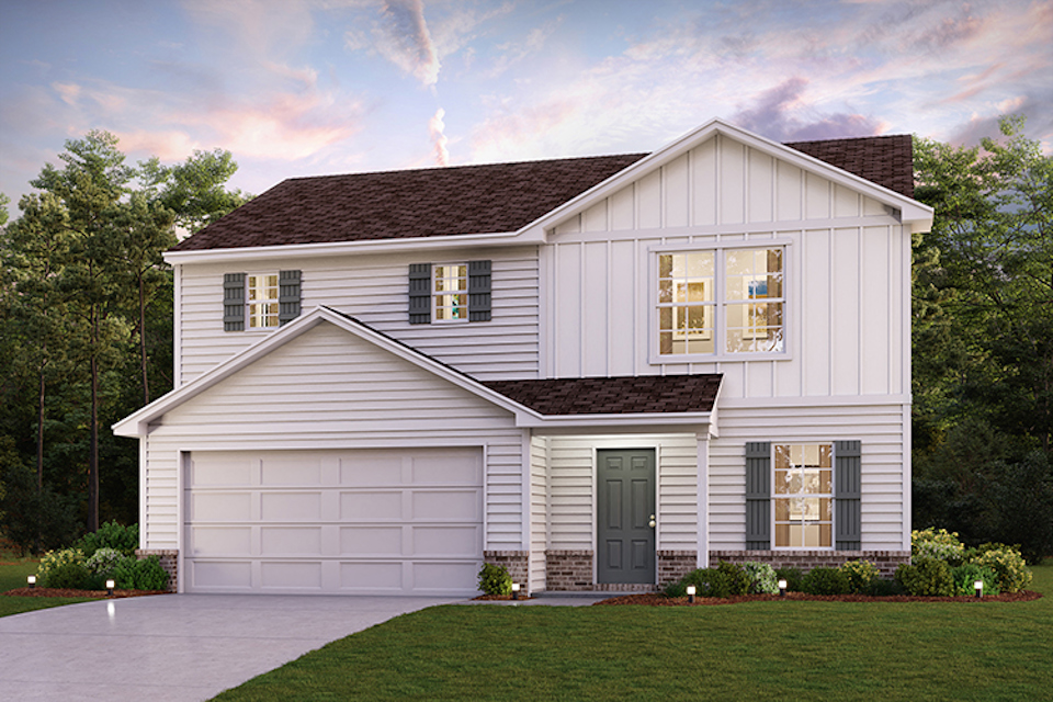 A white house with a garage.