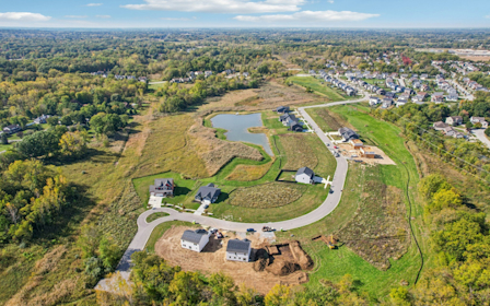 A landscape with houses and trees.