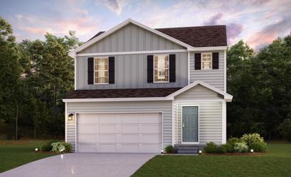 A white house with a garage.
