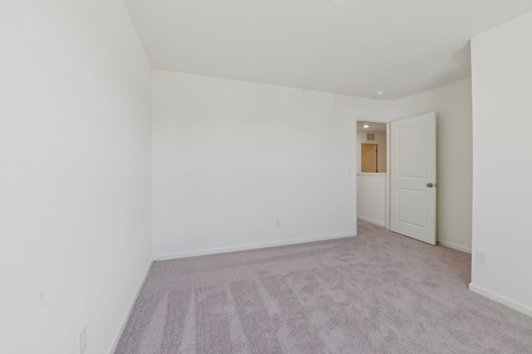 A hallway with white doors.
