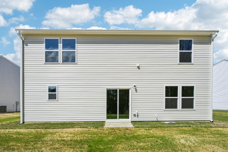 A white house with a garage.