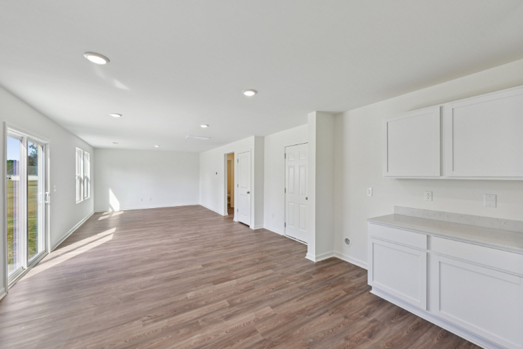 A room with white cabinets.