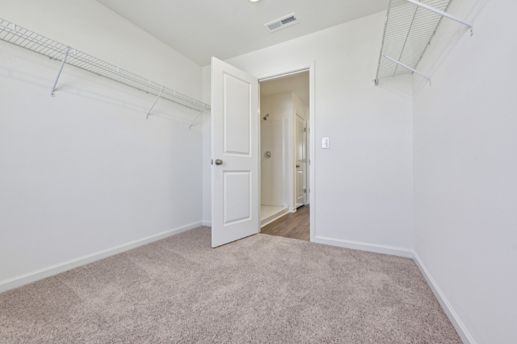 A hallway with white walls.