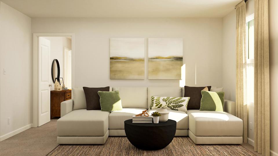 A living room with a couch and a coffee table.