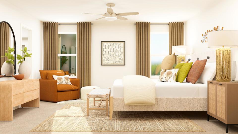 A living room with a couch and a fan.