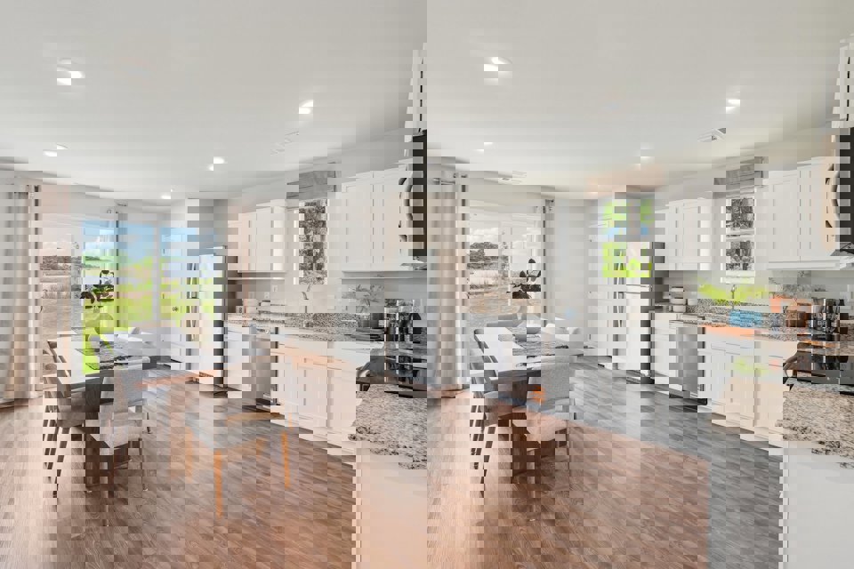 A kitchen with white cabinets.