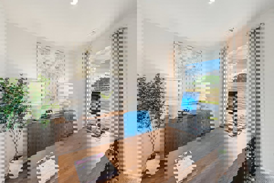 A room with a desk and a computer.