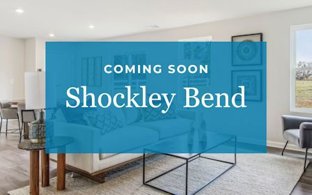 A room with a blue wall and chairs.