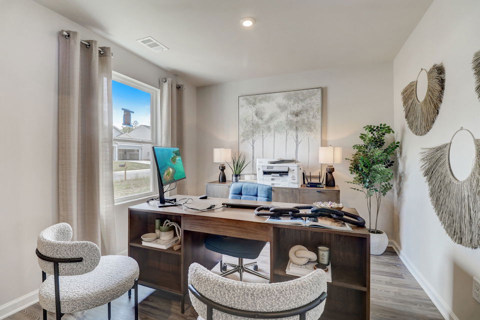 A room with a table and chairs.