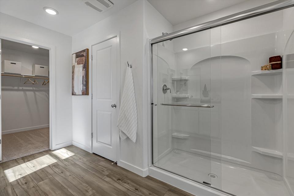A bathroom with a glass shower.